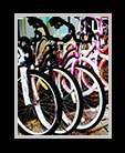 Colorful bicycles lined up outside a store thumbnail